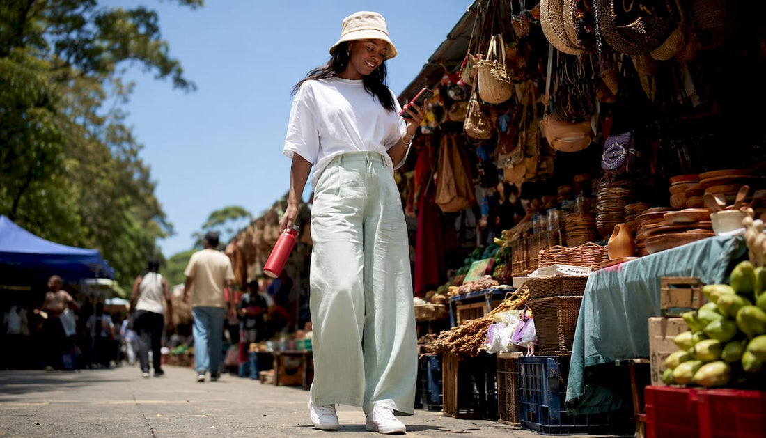 Woman in pastel summer streetwear on city street
