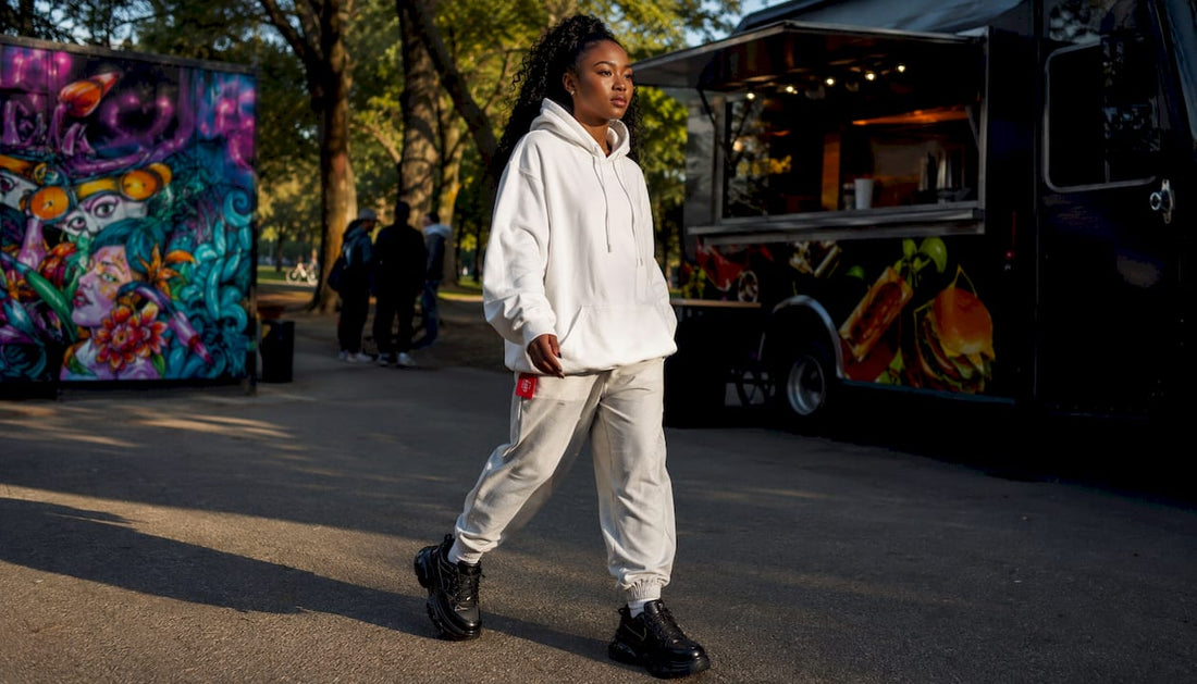 Woman wearing oversized graphic tee and cargo pants outdoors